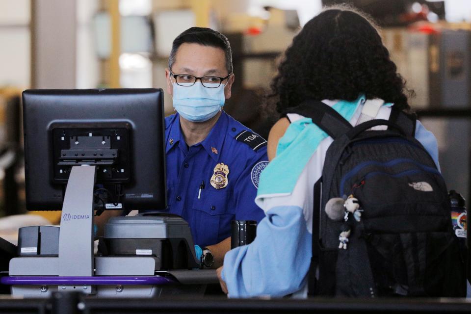 A TSA officer wears a mask at Logan International Airport in Boston in March 2020.