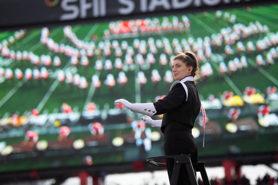 Drum major Amelia Ainbinder leads the Rutgers Marching Scarlet Knights in the halftime performance during the football game against Ohio State at SHI Stadium. The marching band will perform this year in the Macy’s Thanksgiving Day Parade.