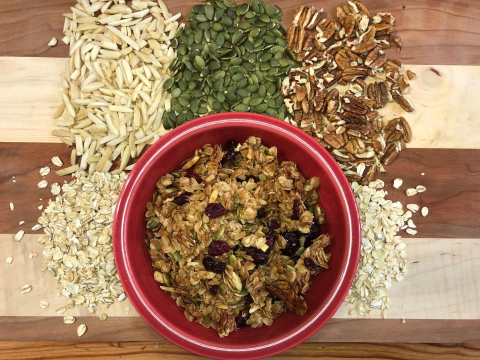 Granola with almond slivers, pepitas, pecan pieces, oats and dried cranberries and cherries.(USAT photo)