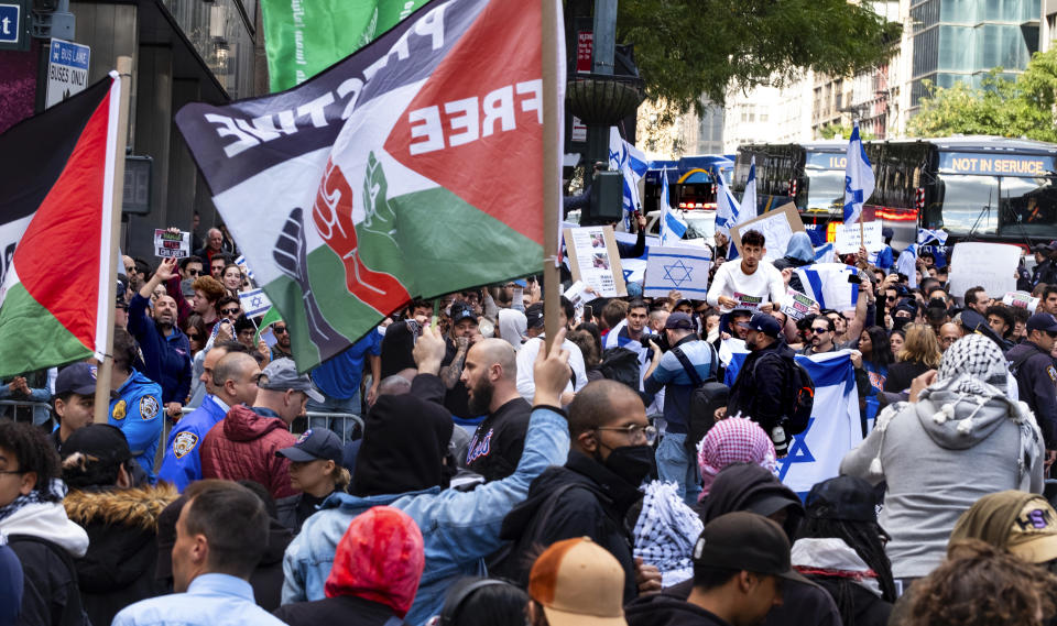 Supporters of Israel and Palestinian supporters gather at the Israeli Consulate in New York, Monday, Oct. 9, 2023, in the wake of an attack on Israel by Hamas. (AP Photo/Craig Ruttle)