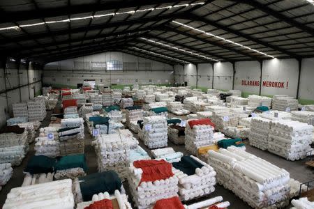 Rolls of cloth are stacked in the warehouse of a textile factory which has its own water treatment facilities located near the Citarum river in Majalaya, south-east of Bandung, West Java province, Indonesia, February 14, 2018. REUTERS/Darren Whiteside