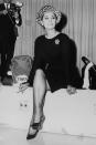 <p>Sophia Loren knew how to travel in style, which is why the actress opted for a belted black coat dress and cheetah print hat while flying with TWA in the '60s. </p>