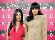Reality television stars Kourtney Kardashian and Kylie Jenner arrive at the 2015 MTV Video Music Awards in Los Angeles, California, August 30, 2015. REUTERS/Danny Moloshok