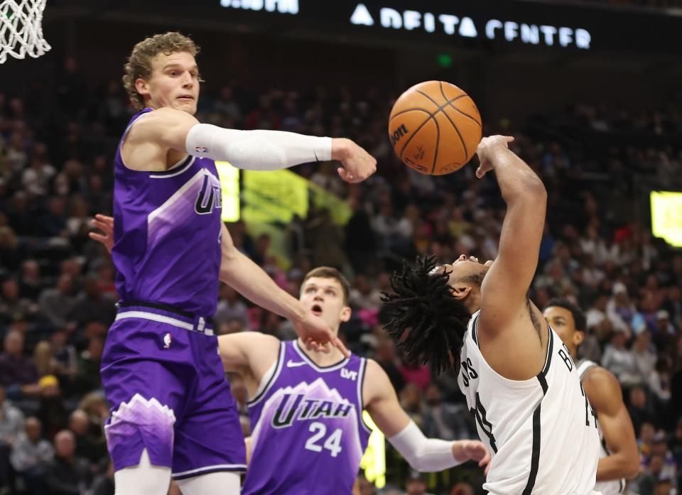 Utah Jazz forward Lauri Markkanen (23) blocks the shot by Brooklyn Nets guard Cam Thomas (24) in Salt Lake City on Monday, Dec. 18, 2023. | Jeffrey D. Allred, Deseret News
