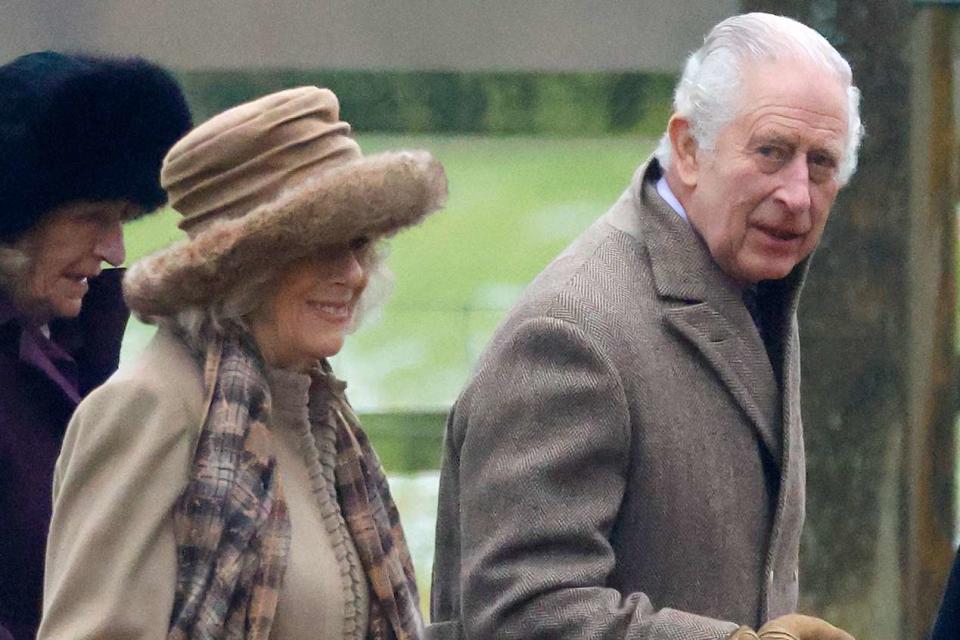 <p>Max Mumby/Indigo/Getty</p> King Charles and Queen Camilla walk to St Mary Magdalene near Sandringham House on Dec. 3. 