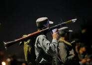 <p>Afghan policemen stand guard at the site of an attack at American University of Afghanistan in Kabul on Aug. 24, 2016. (REUTERS/Mohammad Ismail) </p>