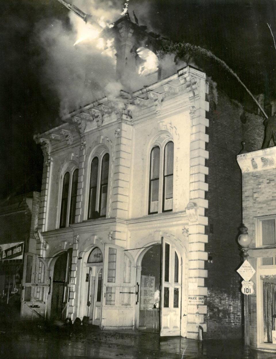 Fire struck San Luis Obispo’s historic fire house and city hall on Higuera Street on Aug. 28, 1938. The police department was down the alley, and a jail was built behind this now-destroyed building that still stands today. A Highway 101 sign can be seen at right.
