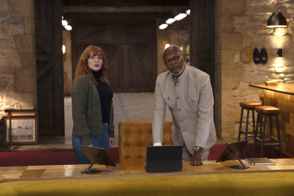 This image released by Apple shows Bryce Dallas Howard, left, and Samuel L. Jackson in a scene from "Argylle." (Peter Mountain/Apple-Universal Pictures via AP)