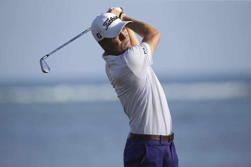 Justin Thomas follows his shot on the 17th tee box during the second round of the Sony Open golf tournament, Friday, Jan. 13, 2017, in Honolulu. (AP Photo/Marco Garcia)