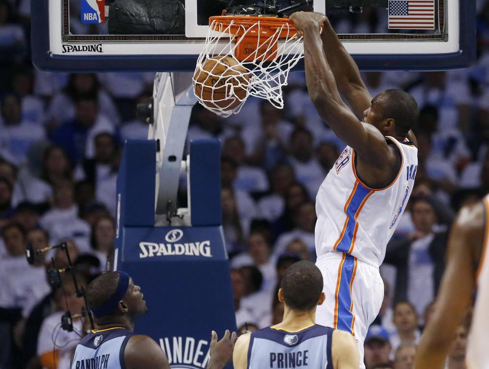 Oklahoma City Thunder forward Serge Ibaka, right, dunks in front of Memphis Grizzlies forward Zach Randolph, left, and forward Tayshaun Prince in the second quarter of Game 5 of an opening-round NBA basketball playoff series in Oklahoma City, Tuesday, April 29, 2014. (AP Photo)