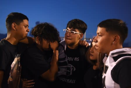 People pay their respects two days after a mass shooting in El Paso