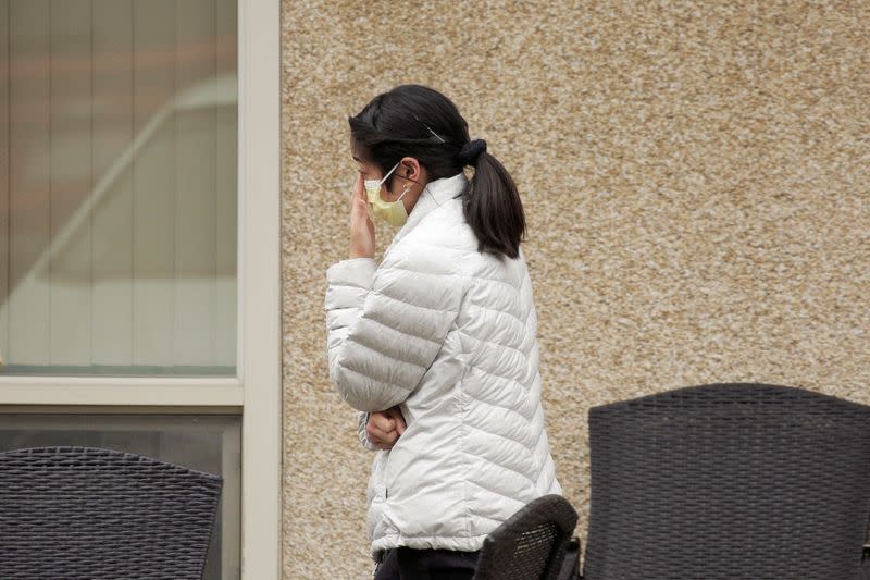 People are seen at the Life Care Center of Kirkland, the long-term care facility linked to several confirmed coronavirus cases, in Kirkland