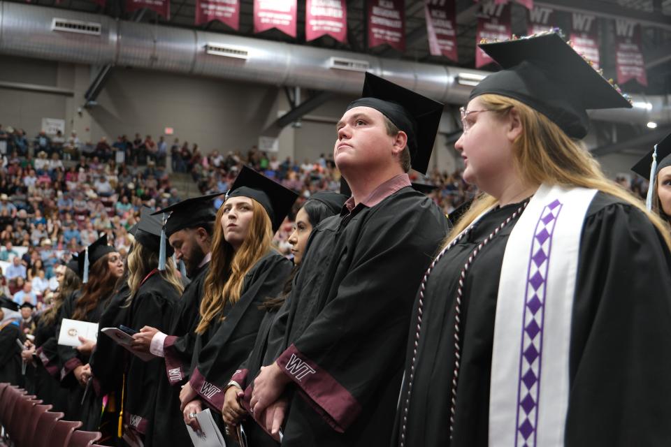 A graduate looks skyward Saturday at the WT Commencement Ceremony in Canyon.