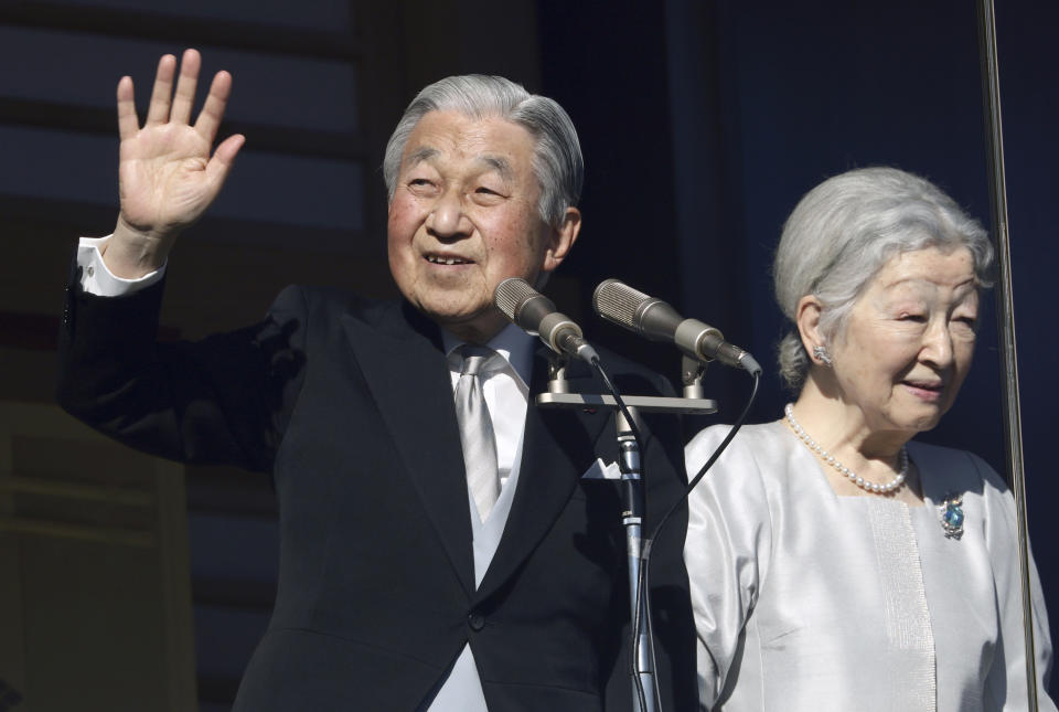 FILE - In this Jan. 2, 2019, file photo, Japan's Emperor Akihito and Empress Michiko greet to well-wishers from the bullet-proofed balcony during his New Year's public appearance with his family members at Imperial Palace in Tokyo. Akihito has devoted his 30-year reign to making amends for a war fought in his father’s name, while adapting the 1,500-year-old monarchy to draw the Imperial Family closer to the public. Akihito’s Heisei era will end when he abdicates on April 30, 2019 in favor of his elder son, 58-year-old Crown Prince Naruhito, beginning a new, as yet unnamed era. (AP Photo/Eugene Hoshiko, File)