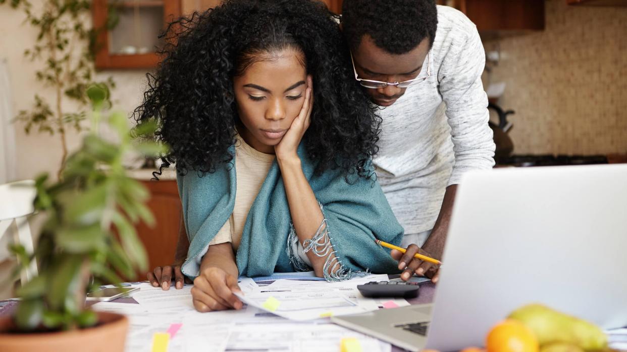 couple frustrated doing their taxes