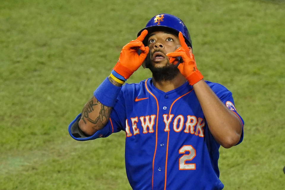 FILE - New York Mets' Dominic Smith reacts after hitting a home run off Philadelphia Phillies pitcher Spencer Howard during the third inning of a baseball game in Philadelphia, in this Friday, Aug. 14, 2020, file photo. First baseman outfielder Dominic Smith and the New York Mets avoided arbitration Friday, Jan. 15, 2021, when they agreed to a $2.55 million, one-year contract. (AP Photo/Matt Slocum, File)