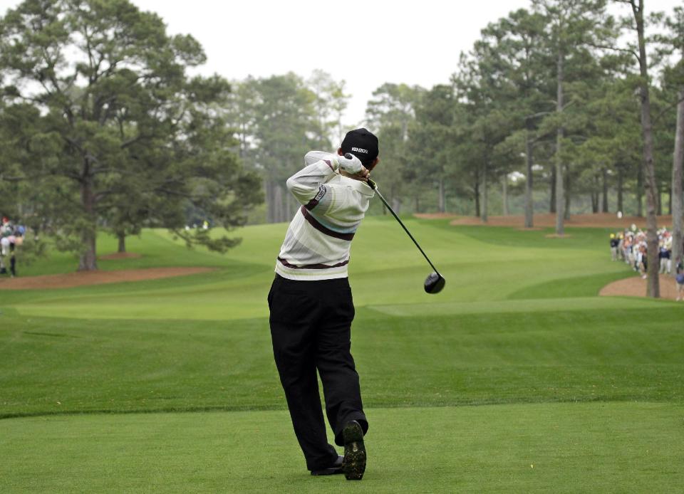 FILE - In this April 8, 2008, file photo, Toru Taniguchi of Japan tees off on the 17th hole of the Augusta National Golf Club, with the Eisenhower Tree at left, during practice for the 2008 Masters golf tournament in Augusta, Ga. The Eisenhower Tree was removed this weekend because of damage from an ice storm, the Augusta National Golf Club chairman Billy Payne said Sunday, Feb. 16, 2014. The loblolly pine was among the most famous trees in golf and it infuriated one of the club members after whom the tree eventually was named — former President Dwight D. Eisenhower. (AP Photo/David J. Phillip, File)