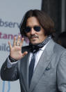 Actor Johnny Depp arrives at the High Court in London, Thursday, July 16, 2020. Depp is suing News Group Newspapers, publisher of The Sun, and the paper’s executive editor, Dan Wootton, over an April 2018 article that called him a “wife-beater.” The Sun’s defense relies on a total of 14 allegations by his ex-wife Amber Heard of Depp’s violence. He strongly denies all of them. (AP Photo/Alastair Grant)