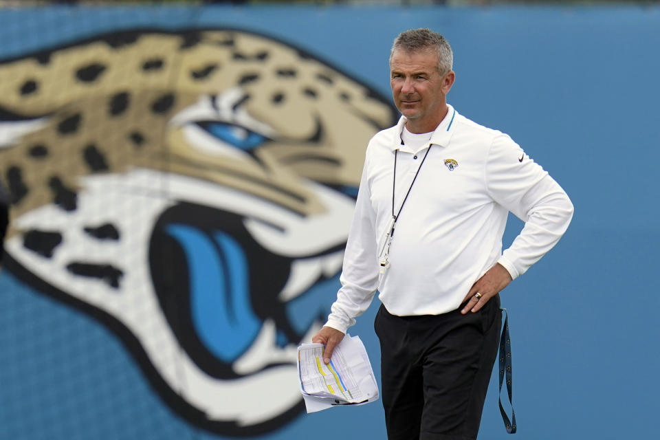 FILE - Jacksonville Jaguars head coach Urban Meyer watches players perform drills during an NFL football practice in Jacksonville, Fla., in this Monday, June 14, 2021, file photo. The Jacksonville Jaguars said Wednesday, July 14, 2021, that coach Urban Meyer and general manager Trent Baalke were subpoenaed as part of a lawsuit filed by lawyers for Black players suing former Iowa strength coach Chris Doyle for discrimination. (AP Photo/John Raoux, File)