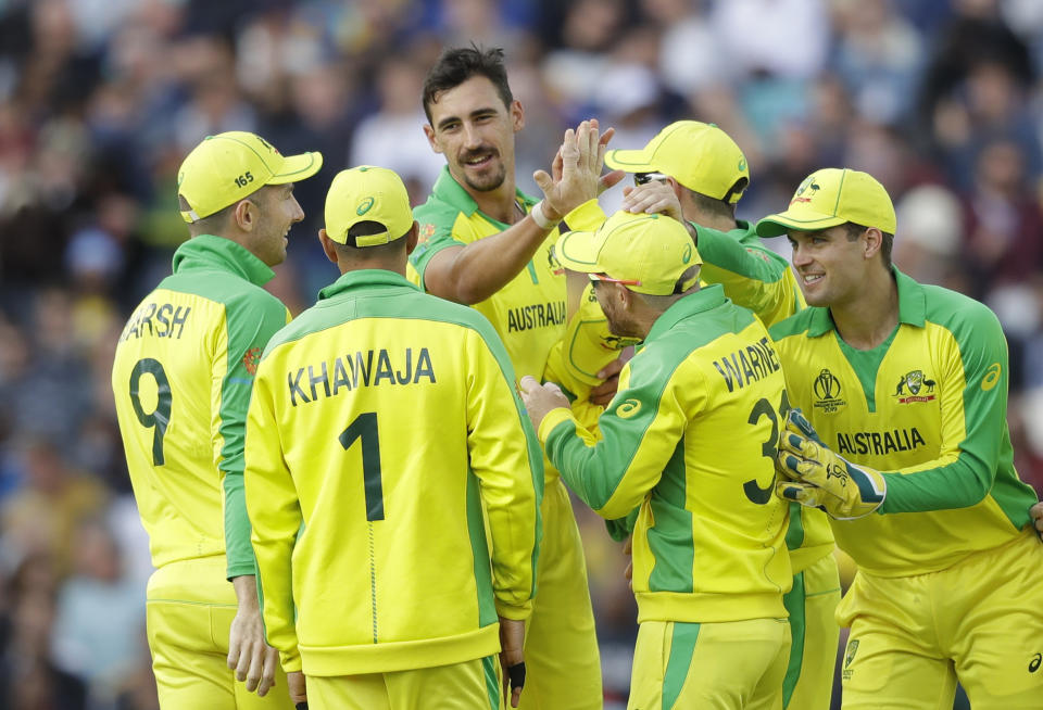 Australia's Mitchell Starc, centre, celebrates taking the wicket of Sri Lanka's Thisara Perera during the World Cup cricket match between Sri Lanka and Australia at The Oval in London, Saturday, June 15, 2019. (AP Photo/Kirsty Wigglesworth)