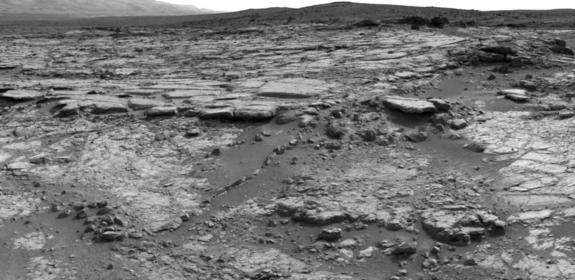 The sinuous rock feature in the lower center of this mosaic of images recorded by the NASA Mars rover Curiosity is called "Snake River." Image taken Dec. 20, 2012.