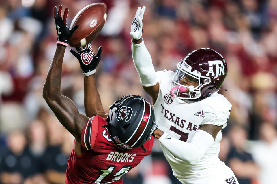 Oct 22, 2022; Columbia, South Carolina; South Carolina Gamecocks wide receiver Jalen Brooks (13) cannot come up with the reception as Texas A&M Aggies defensive back Tyreek Chappell (7) defends in the second quarter at Williams-Brice Stadium. Jeff Blake-USA TODAY Sports