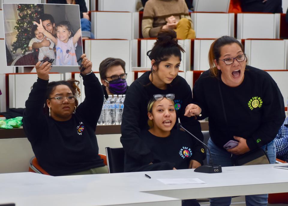 Adelaide Castro comforts her boyfriend's sister, Aysha Waddell, as she and her mother, Sonya, and sister, Ahmoni, left, address members of the Binghamton City Council on Wednesday, Jan. 11.