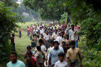 FILE PHOTO: Men walk at a Rohingya village outside Maugndaw in Rakhine state, Myanmar October 27, 2016. REUTERS/Soe Zeya Tun/File Photo