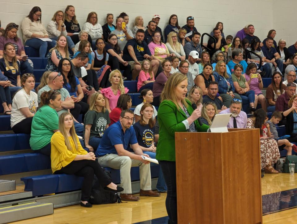 Theresa Nitkiewicz, a Woodmore Local Schools parent, speaks to the school board in support of middle school principal Kevin Ball.