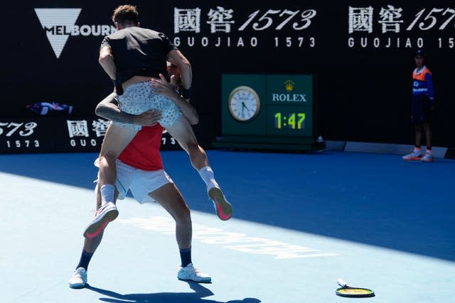 Thanasi Kokkinakis jumps into Nick Kyrgios' arms 