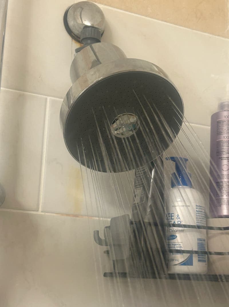 The Filtered Shower head by Jolie in use in a shower