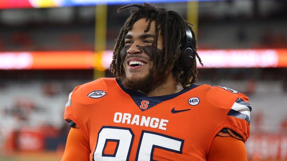 Josh Black smiles during pregame warmups for one of the Syracuse football games this season. Black wrapped up his five-year career after starting every game on the defensive line the past three seasons.