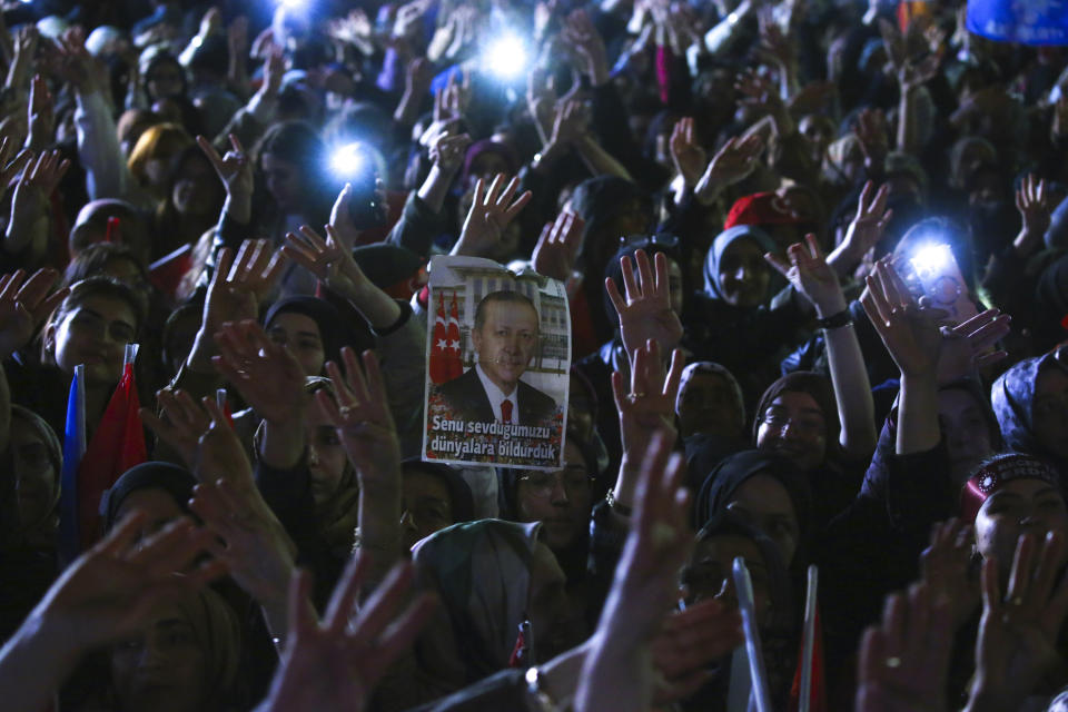 Supporters of Turkish President Recep Tayyip Erdogan cheer at the party headquarters, in Ankara, Turkey, early Monday, May 15, 2023. Erdogan, who has ruled his country with an increasingly firm grip for 20 years, was locked in a tight election race Sunday, with a make-or-break runoff against his chief challenger possible as the final votes were counted. (AP Photo/Ali Unal)