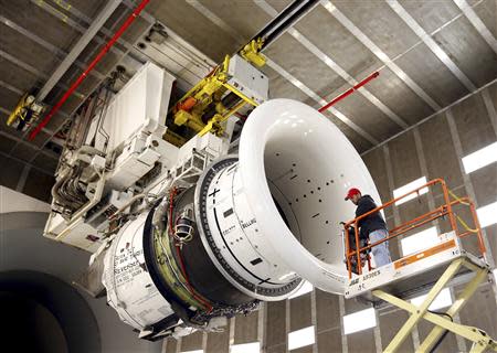 General Electric employee Brian Kirk prepares a GEnx-747 jet engine at the GE Aviation Peebles Test Operations Facility in Peebles, Ohio in this file photo taken November 15, 2013. REUTERS/Matt Sullivan/Files