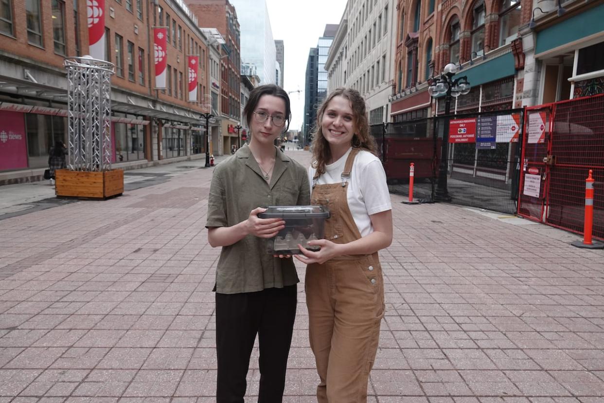 Emily McColville, left, and Sophie Kasdorf, right, are part of Team Insecta, which is researching how microgravity affects crickets at different life stages. (Jodie Applewaithe/CBC - image credit)