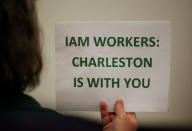 A supporter holds a small sign at a rally held by The International Association of Machinists and Aerospace Workers for Boeing South Carolina workers before Wednesday's vote to organize, in North Charleston, South Carolina, U.S. February 13, 2017. REUTERS/Randall Hill