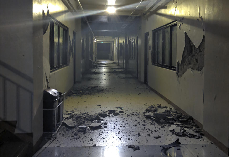 Debris is scattered on the floor of a damaged building in Digos, Davao del Sur province, southern Philippines on Wednesday Oct. 16, 2019. A powerful and shallow earthquake hit several southern Philippine provinces Wednesday night injuring some people in collapsed houses and prompting thousands to scramble out of homes, shopping malls and a hospital in panic, officials and news reports said. (AP Photo/Romell Bacongco)