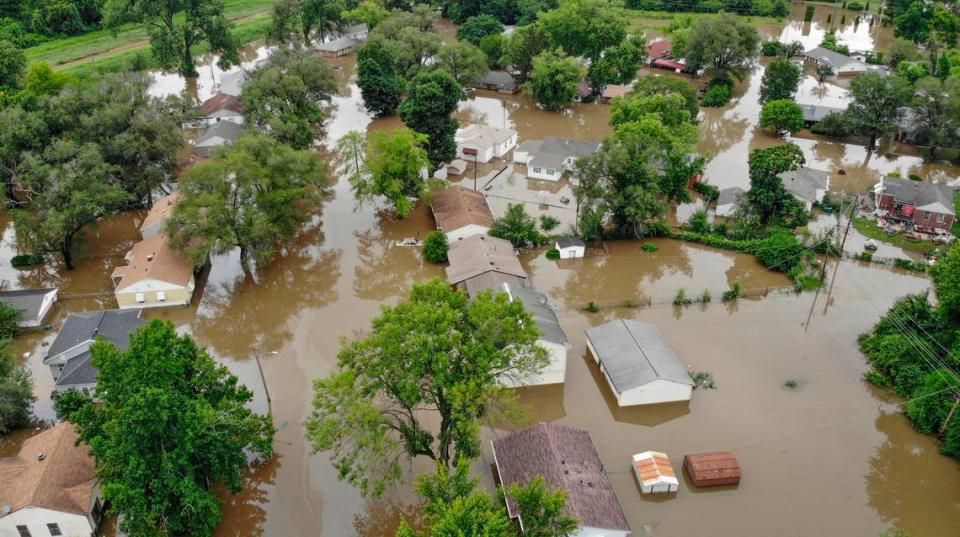 A day later and after most of the rain stopped in the region, homes and vehicles on Terrace Drive and Mary Avenue in East St. Louis still remain flooded. Residents believe the pumps that drain the area are not working. Derik Holtmann/dholtmann@bnd.com