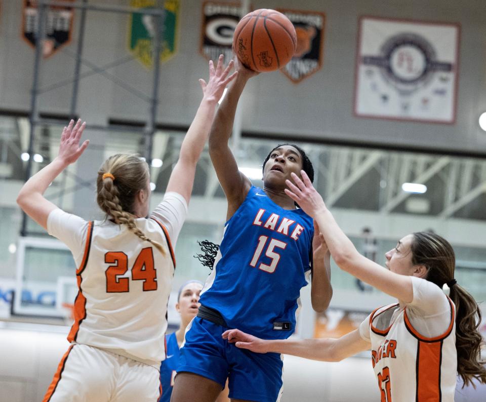 Lake's Serenitee Johnson shoots over Hoover's Stella Somers, 24, and Aubrey Fisher, 42, in the first half, Wednesday, Jan. 31, 2024.