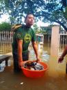 PAWS volunteers used washbasins and styrofoam containers to help stranded pets.