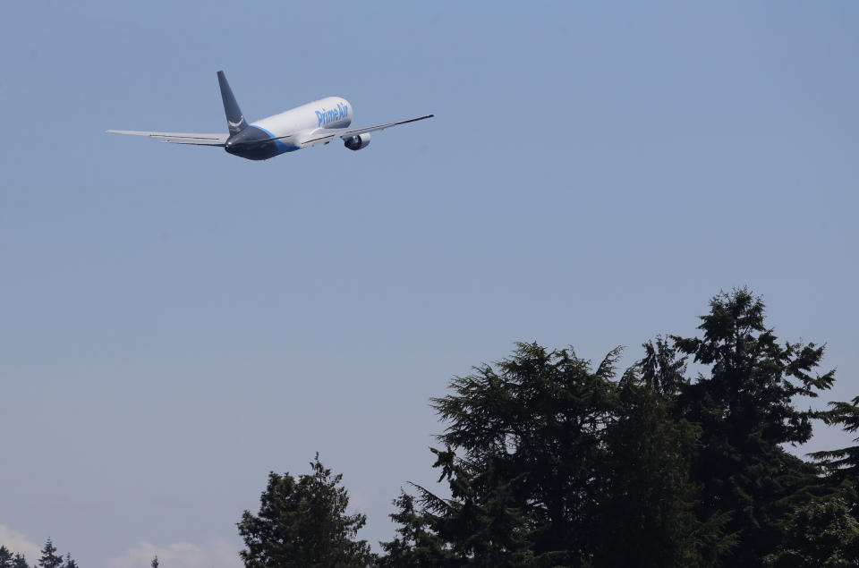 A Boeing 767 with an Amazon.com "Prime Air" livery flies over Lake Washington, Friday, Aug. 5, 2016, as part of the Boeing Seafair Air Show. Amazon unveiled its first branded cargo plane Thursday, one of 40 freighters that will make up the company's own air transportation network of 40 Boeing jets leased from Atlas Air and Air Transportation Services Group, which will operate the air cargo network. (AP Photo/Ted S. Warren)