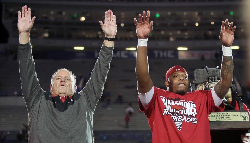 Dec 28, 2022; Memphis, TN, USA; Arkansas Razorbacks head coach Sam Pittman and quarterback KJ Jefferson call the hogs after defeating the <a class="link " href="https://sports.yahoo.com/ncaaw/teams/kansas/" data-i13n="sec:content-canvas;subsec:anchor_text;elm:context_link" data-ylk="slk:Kansas Jayhawks;sec:content-canvas;subsec:anchor_text;elm:context_link;itc:0">Kansas Jayhawks</a> in the 2022 Liberty Bowl at Liberty Bowl Memorial Stadium. <a class="link " href="https://sports.yahoo.com/ncaaw/teams/arkansas/" data-i13n="sec:content-canvas;subsec:anchor_text;elm:context_link" data-ylk="slk:Arkansas;sec:content-canvas;subsec:anchor_text;elm:context_link;itc:0">Arkansas</a> won 55-53. Mandatory Credit: Nelson Chenault-USA TODAY Sports