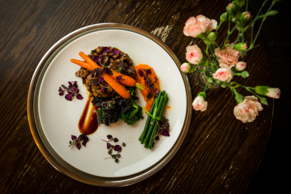 <em>It is topped off with a garnish of purple shiso and also features a swoosh of carrot puree (SWNS)</em>