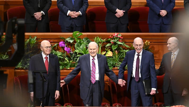 Church President Russell M. Nelson, center; President Dallin H. Oaks, first counselor in the First Presidency, left; and President Henry B. Erying, second counselor in the First Presidency, stand during the Saturday afternoon session of the 194th Annual General Conference of The Church of Jesus Christ of Latter-day Saints on April 6, 2024.