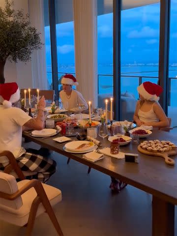 <p>Nicola Peltz/TikTok</p> Cruz, Brooklyn and Harper Beckham enjoy a Christmas dinner with family