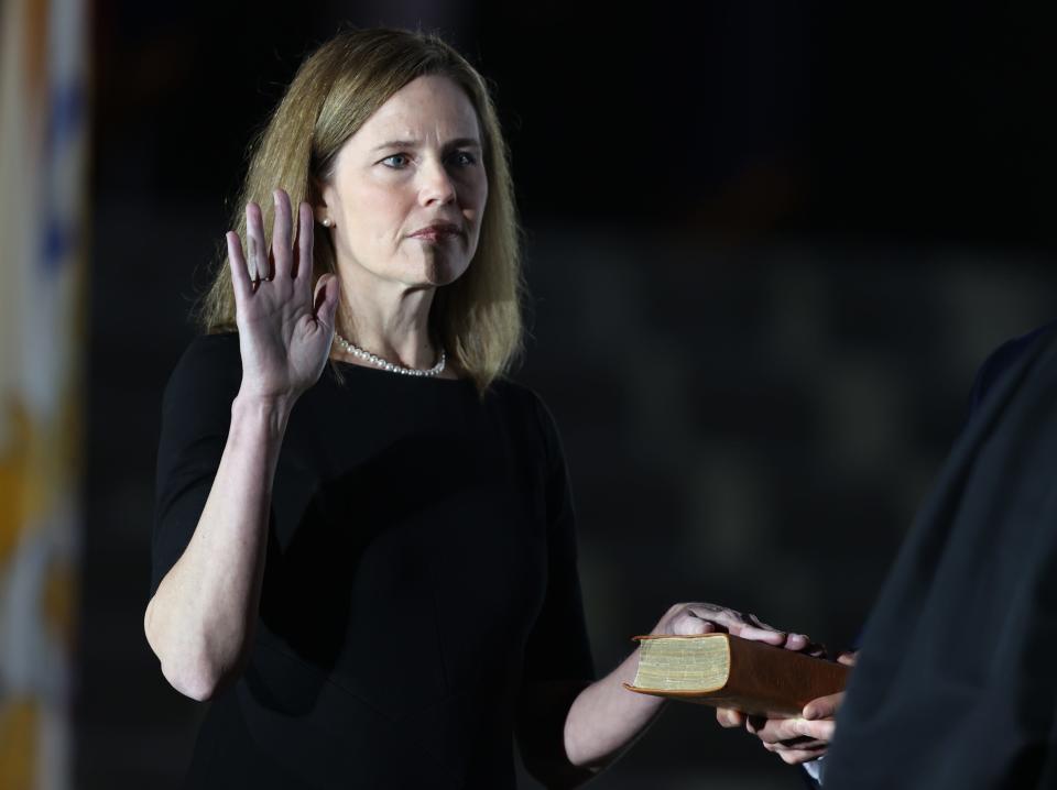 Supreme Court Associate Justice Amy Coney Barrett is sworn in by Supreme Court Associate Justice Clarence Thomas during a ceremonial swearing-in event on the South Lawn of the White House October 26, 2020, in Washington, D.C.