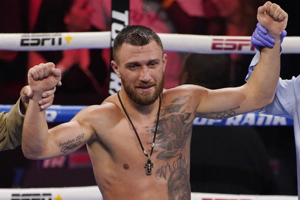 Vasiliy Lomachenko, of Ukraine, celebrates after defeating Masayoshi Nakatani, of Japan, by technical knockout during a lightweight bout Saturday, June 26, 2021, in Las Vegas. (AP Photo/John Locher)