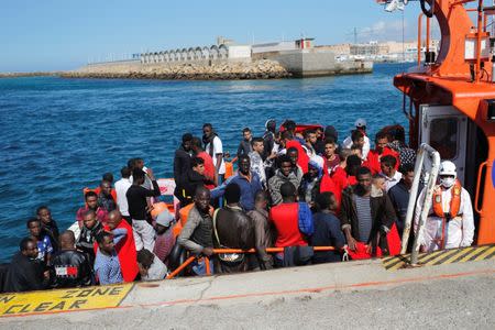 Migrants, intercepted aboard two dinghies off the coast in the Strait of Gibraltar, wait on a rescue boat to disembark after arriving at the port of Tarifa, southern Spain July 15, 2018. REUTERS/Jon Nazca