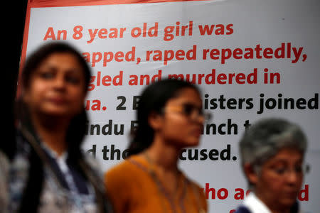 People attend a protest against the rape of an eight-year-old girl, in Kathua, near Jammu and a teenager in Unnao, Uttar Pradesh state, in New Delhi, India April 15, 2018. REUTERS/Cathal McNaughton