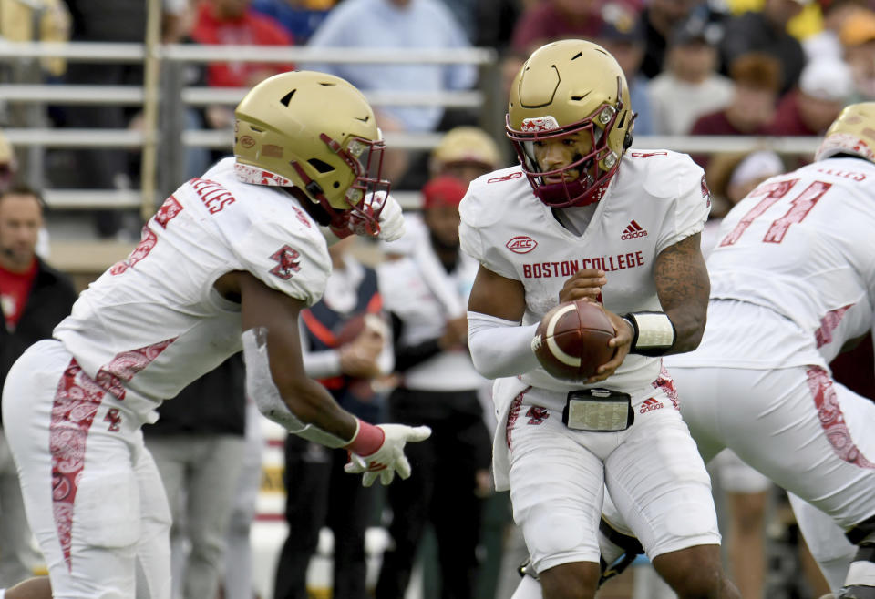 Boston College quarterback Thomas Castellanos (1) hands the ball of to running back Kye Robichaux (5) during the second half of an NCAA college football game against Florida State, Saturday, Sept. 16, 2023 in Boston. (AP Photo/Mark Stockwell)